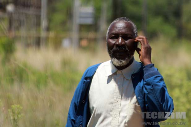 old man on phone, pensioner biometric registration