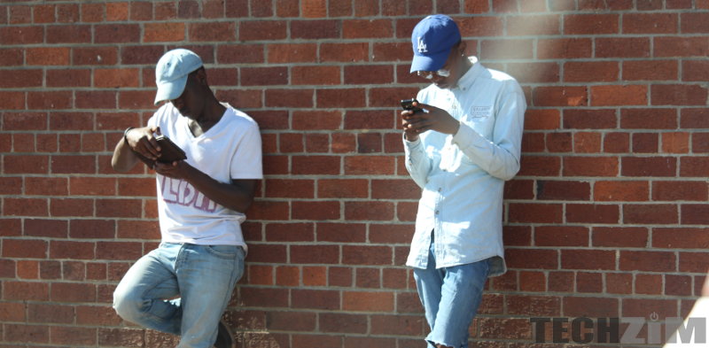 Two men holding phones, on social media