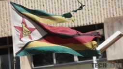 Torn Zimbabwe flag flying