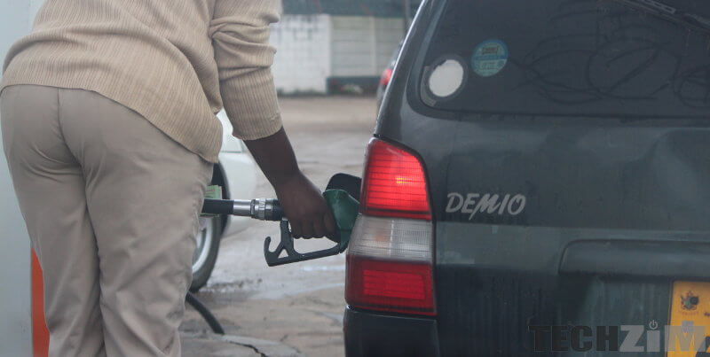 Man filling a car up with fuel prices New ZImbabwe