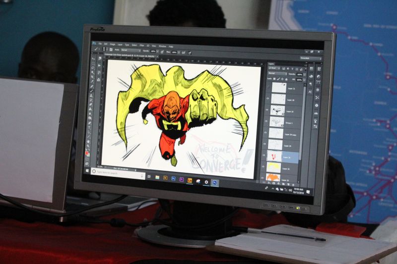 computer with an nimation drawing of a superhero